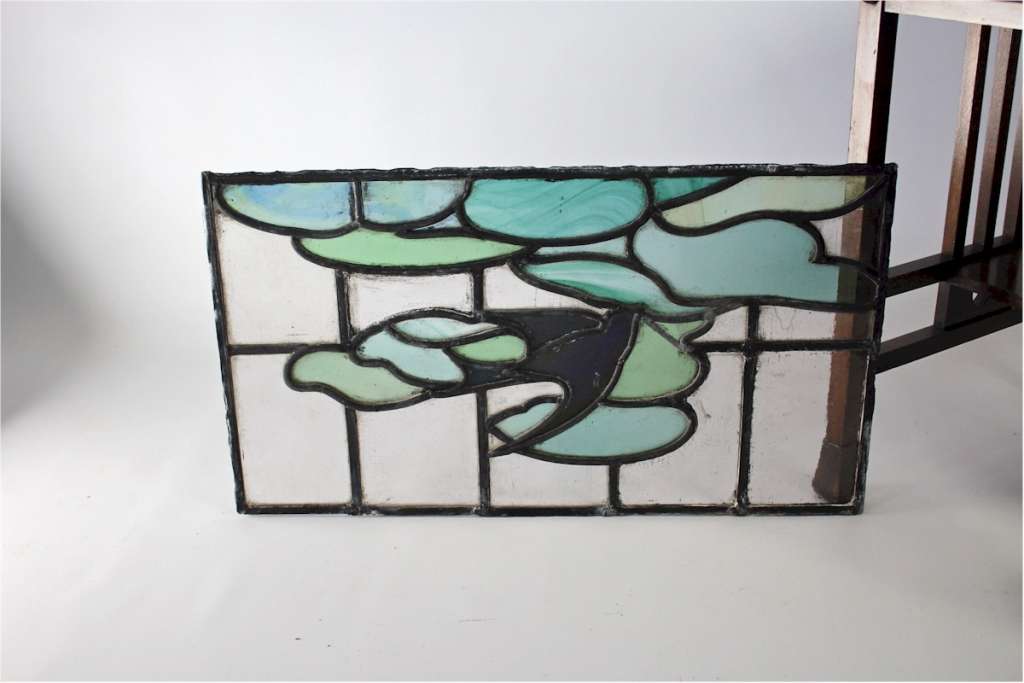 Arts and Crafts stained glass panel with Swallow