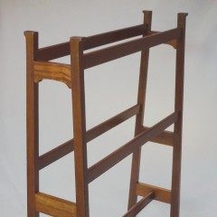 Arts and crafts towel rail of tapered construction