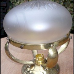 Small domed ceiling light in hammered brass