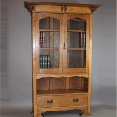 Arts and Crafts cottage oak glazed bookcase with pierced cut-outs
