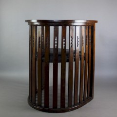 Arts and Crafts mahogany barrel chair with pierced cutouts. c1910