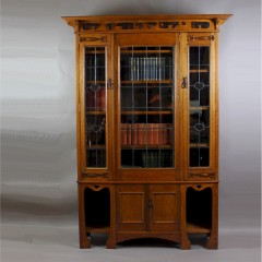 Arts and Crafts oak glazed bookcase with Motto