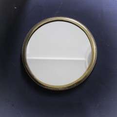 Circular brass ribbed wall mirror