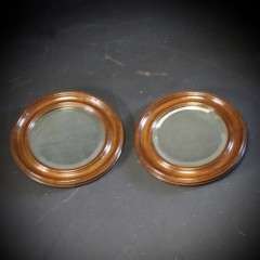 pair of oak framed circular mirrors