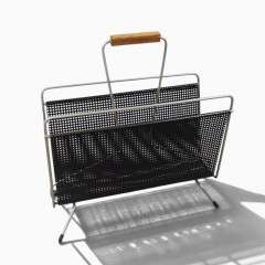Perforated magazine rack from the 1950's