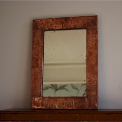Simple arts and crafts copper framed mirror . c1900
