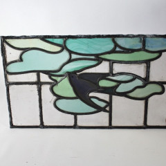 Arts and Crafts stained glass panel with Swallow